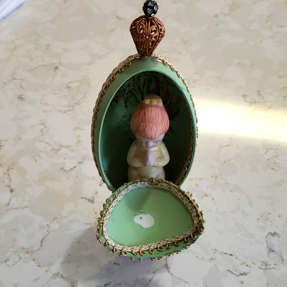 Decorative embellished egg on stand